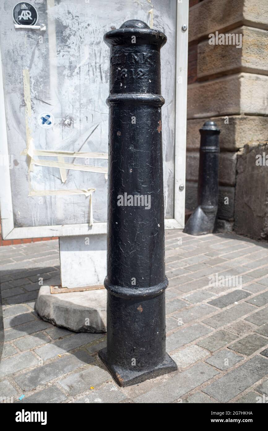 Historic Clink Bollard, with Clink 1812 on its face, one of 60 created in 1860 by the Clink Paving Commissioners, made by Messrs. Bishop & Co Stock Photo