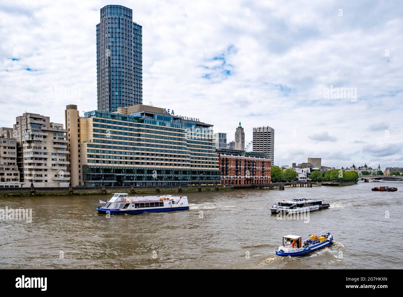 London South Bank skyline with Sea Containers, South Bank Tower, Oxo Tower Wharf and LWT Tower, with busy pleasure boat traffic on the Thames below. Stock Photo