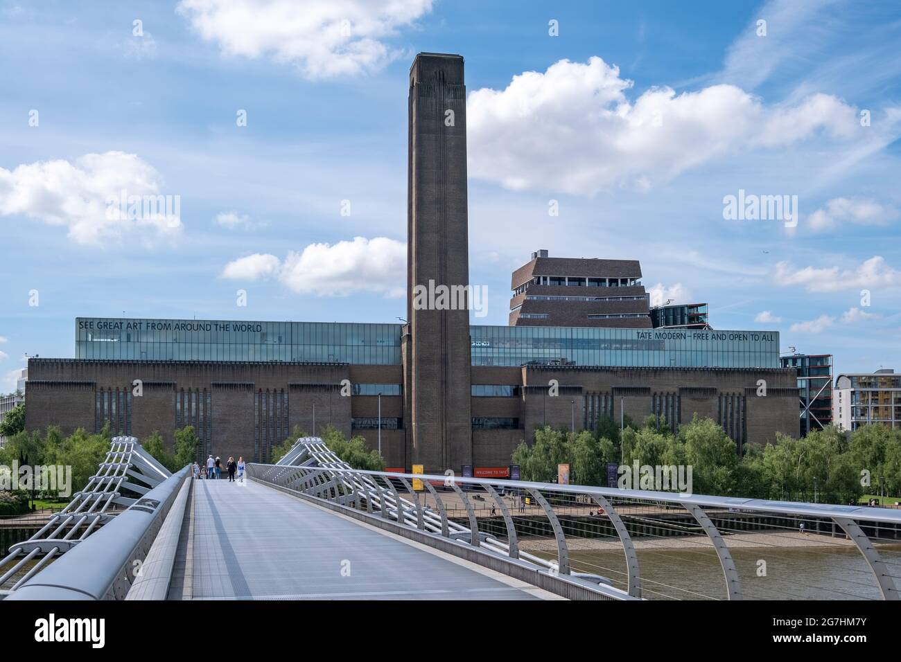 Tate Modern art gallery, from Millennium Bridge, formerly the Bankside Power Station designed by Sir Giles Gilbert Scott completed in 1947 Stock Photo