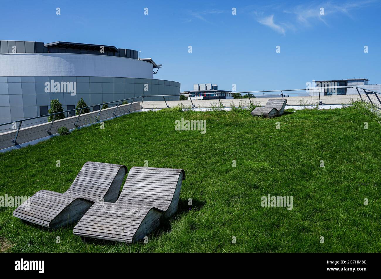 Students at the Technical University of Munich, Garching Campus can relax on the deck chairs of the subway station Garching Forschungszentrum. Stock Photo