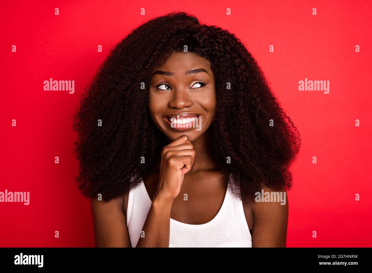 Photo of young african girl happy positive smile hand touch chin think ...
