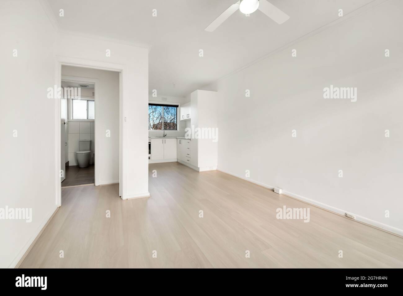 Empty living room with a small kitchen and bathroom. Empty apartment ...
