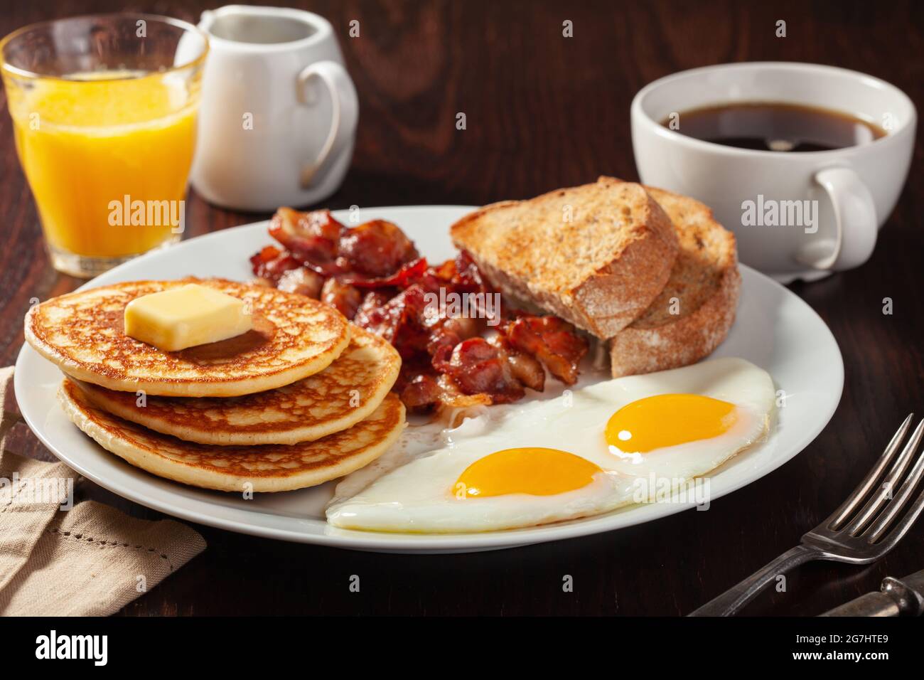traditional full american breakfast eggs pancakes with bacon and toast ...