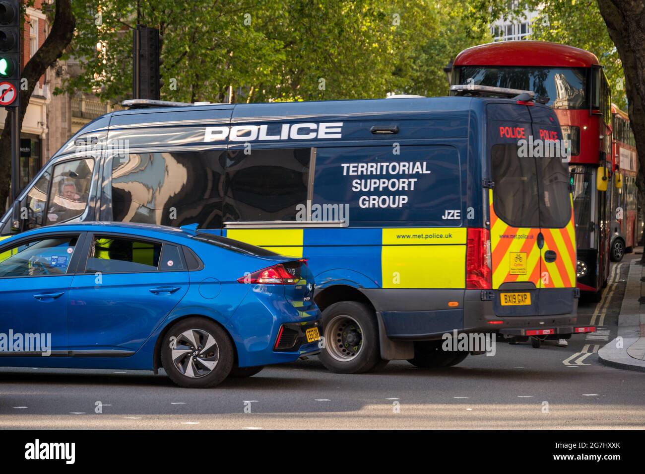 LONDON - MAY 29, 2021: A Police Territorial Support Group van in traffic on a London street Stock Photo