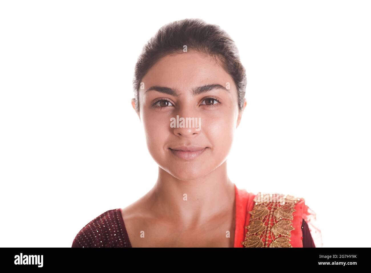 Portrait of smiling young adult indian woman in red sari isolated on ...