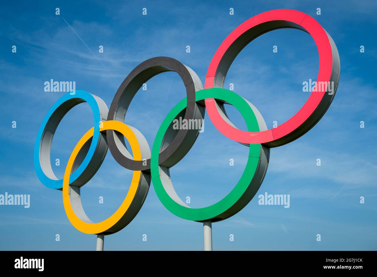 RIO DE JANEIRO - OCTOBER, 2015: A large set of Olympic Rings stand under bright blue sky. Stock Photo