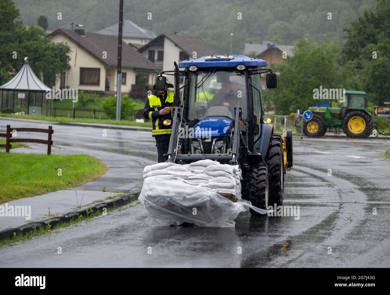 Lasel, Germany. 14th July, 2021. Members of the volunteer fire brigade