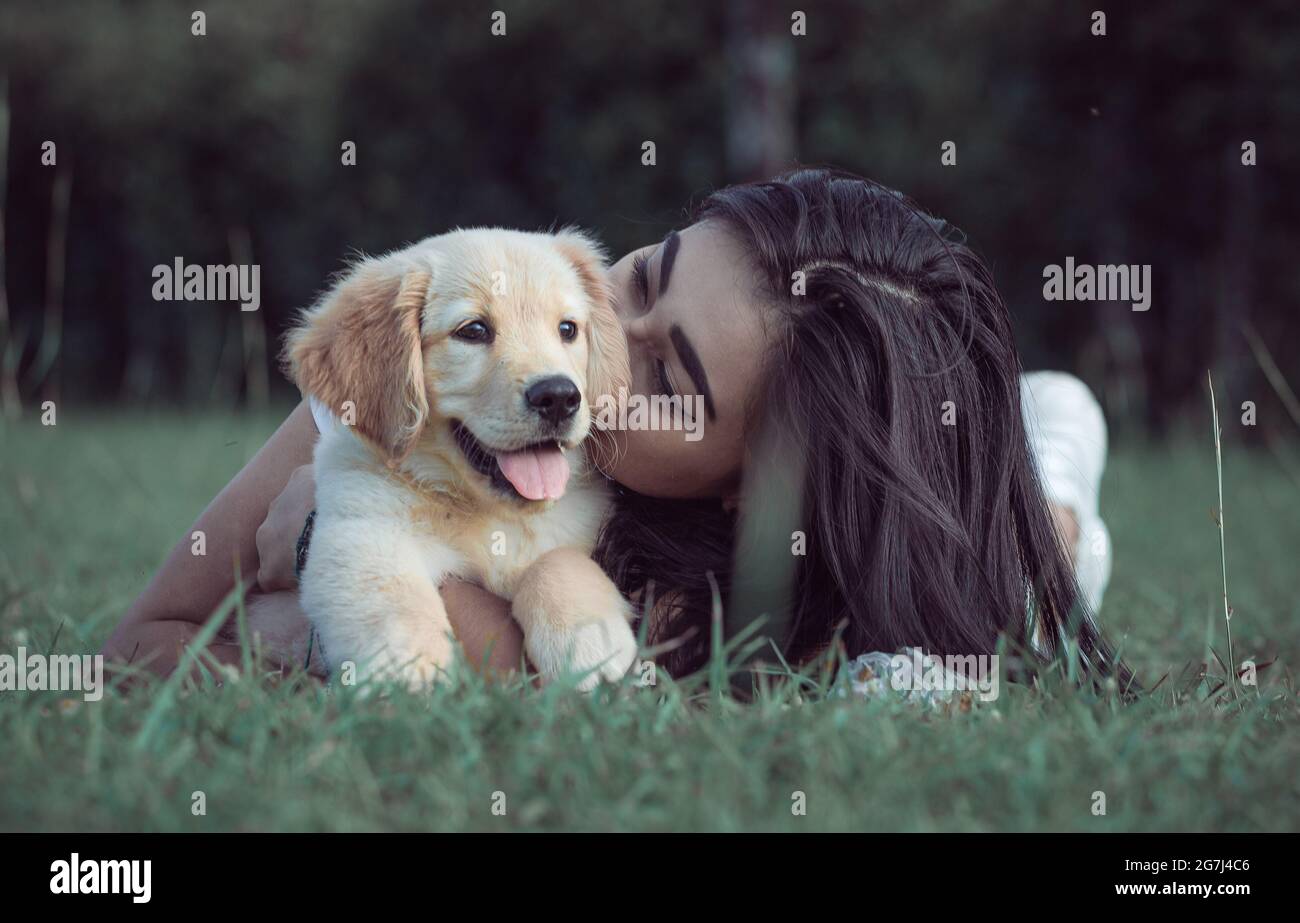 Young girl posing outdoors with her friendly dog Stock Photo - Alamy