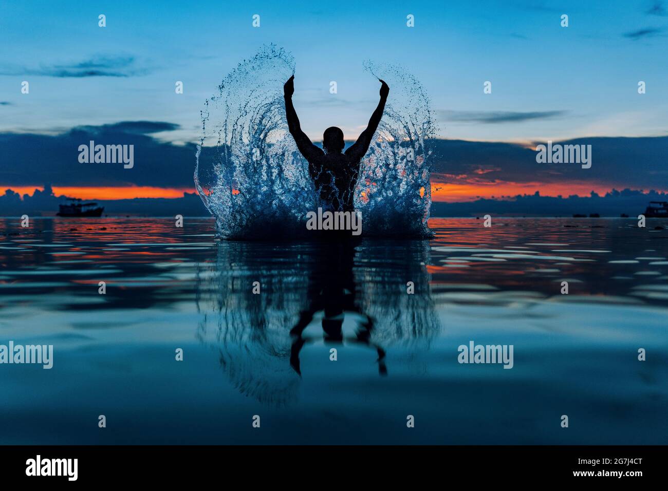 Angel Jumping of Water Souvenir of a Sunset Stock Photo