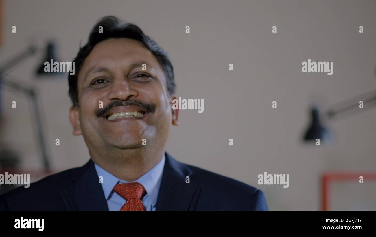 Closeup shot of an Indian successful businessman Stock Photo
