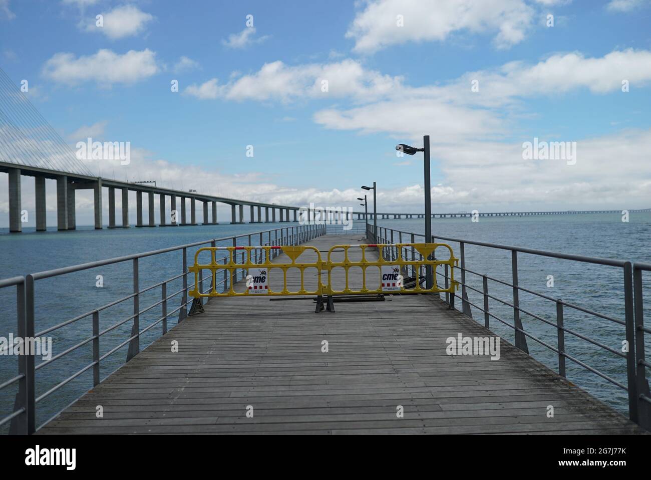 Scenic view of a wooden bridge on a cloudy sky background Stock Photo ...