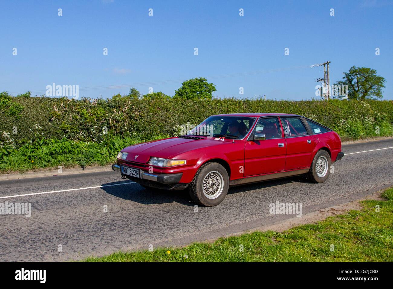 1976 70s red Rover  3500 SD1, 3528cc petrol 4dr british saloon car en-route to Capesthorne Hall classic May car show, Cheshire, UK Stock Photo