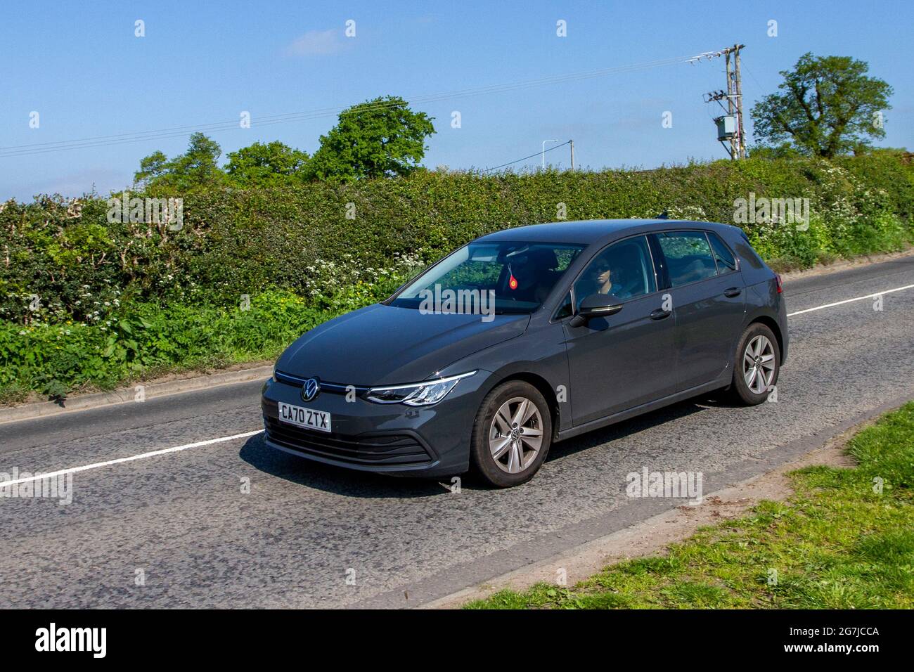 2021 grey VW Volkswagen Golf Life 4dr 6-speed manual, 999cc petrol en-route to Capesthorne Hall classic May car show, Cheshire, UK Stock Photo