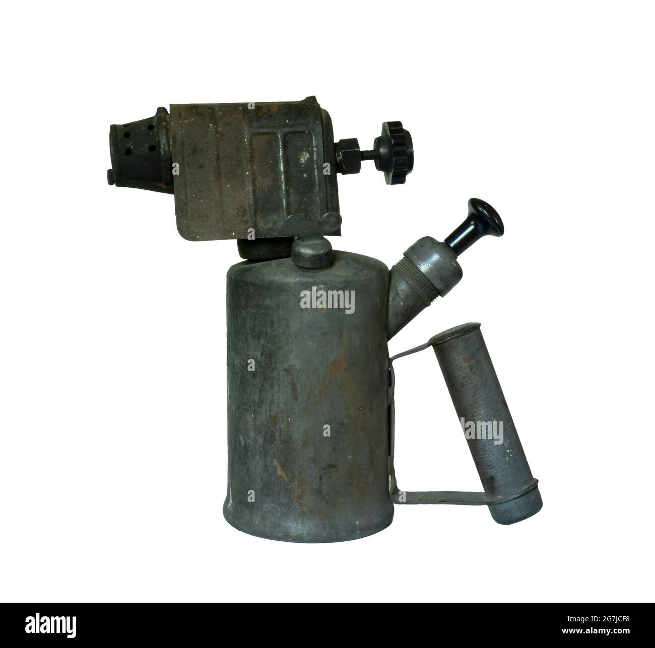An old blowtorch insulated on a white background. Rusty burner with a tank for gasoline Stock Photo