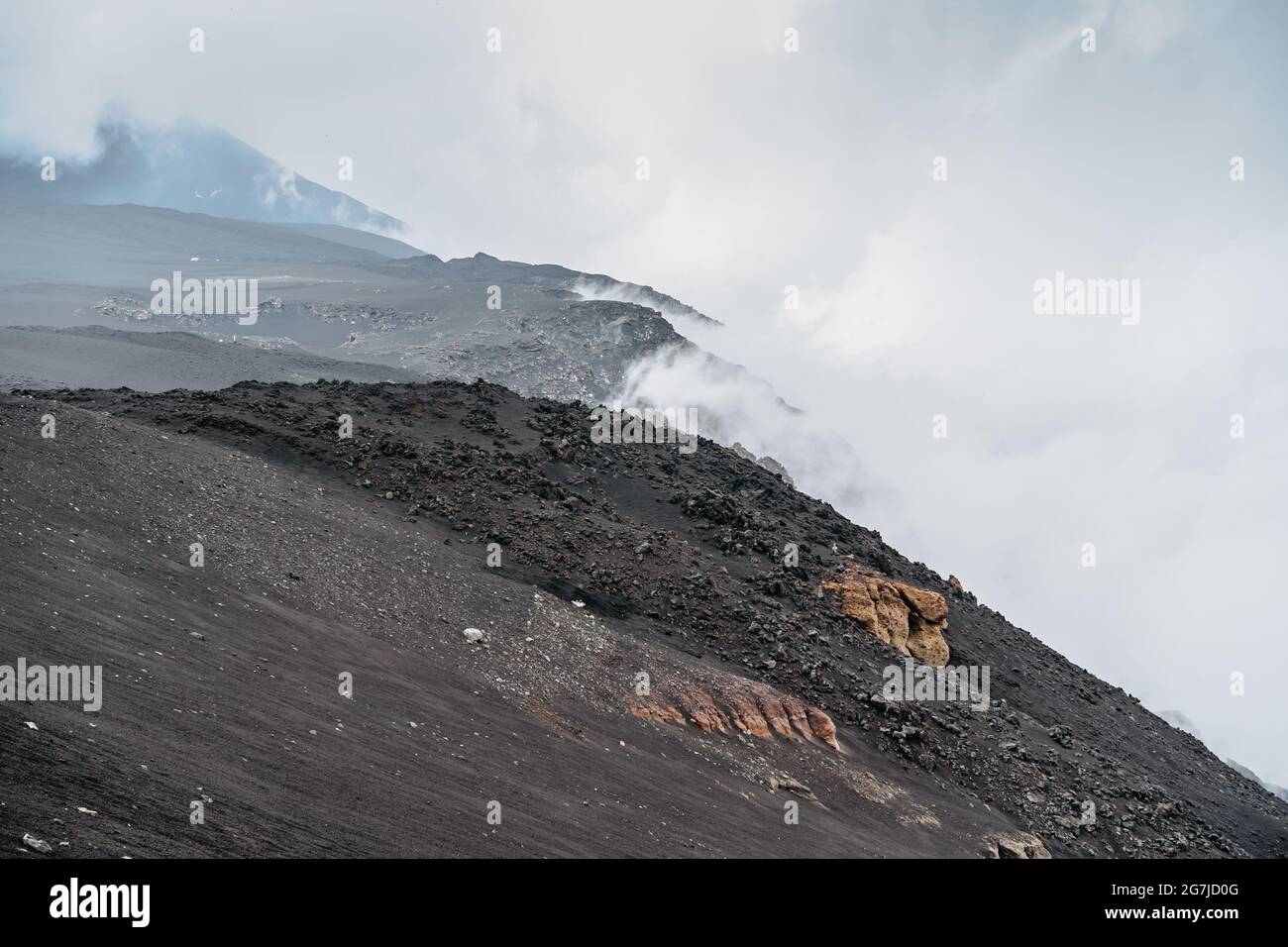 Crater of Etna,Sicily,Italy.Adventure outdoor activity.Excursion on summit of volcano.Parco dell'Etna,protected nature area.Travel freedom background. Stock Photo