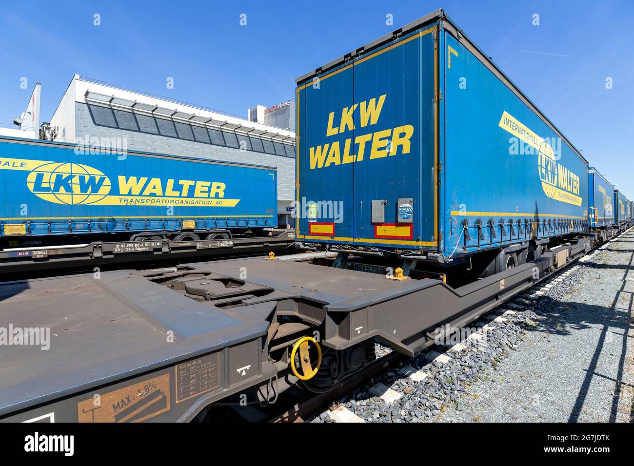 LKW Walter curtainside trailers on semi-trailer flatcars Stock Photo