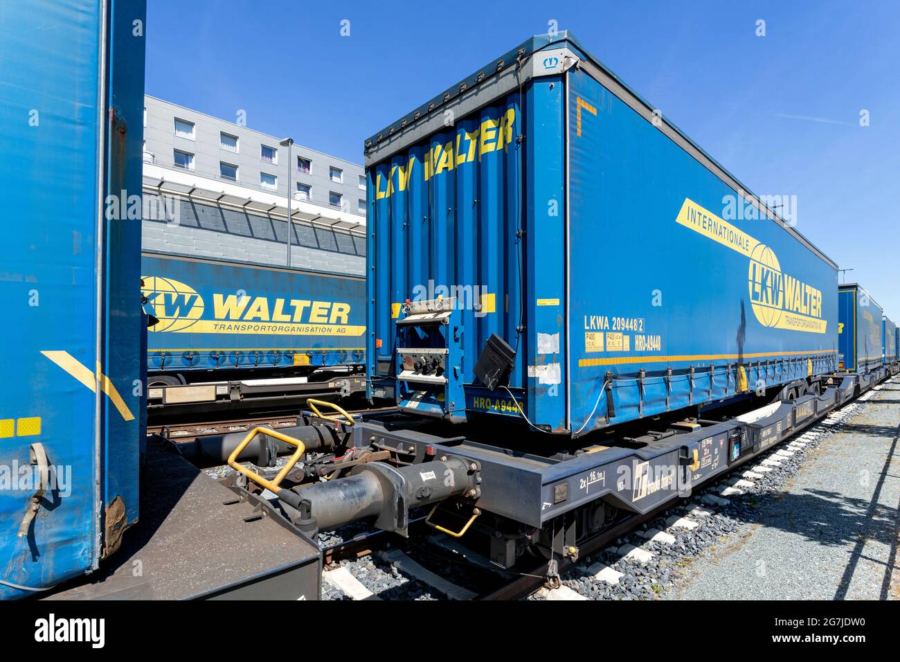 LKW Walter curtainside trailers on semi-trailer flatcars Stock Photo