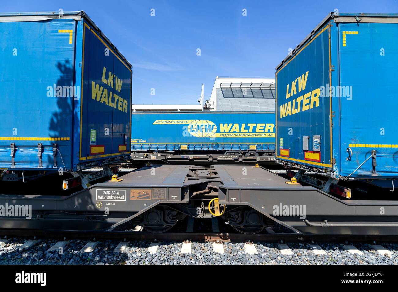 LKW Walter curtainside trailers on semi-trailer flatcars Stock Photo