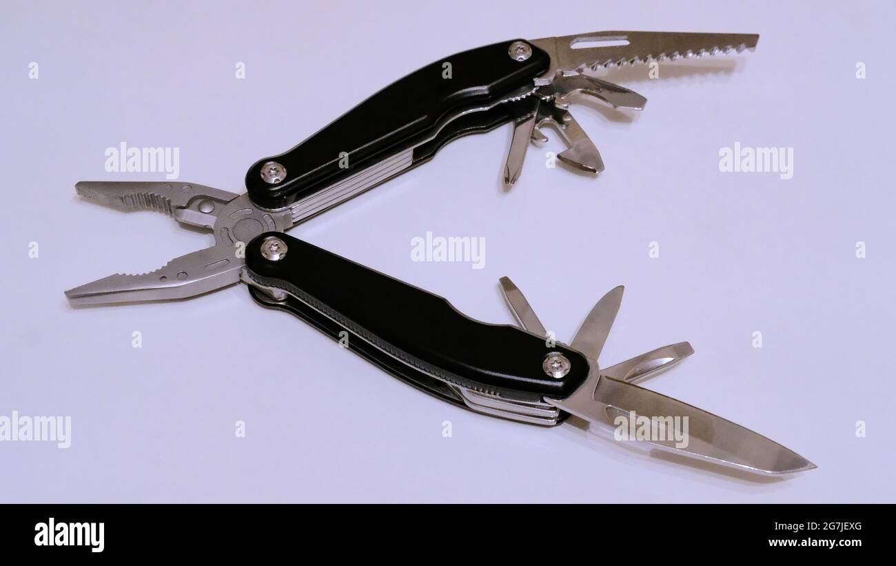 Black multitool on a white background side view Stock Photo