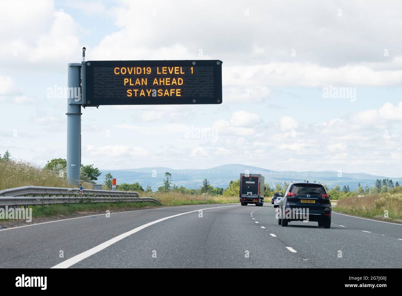 COVID19 level 1 motorway sign, Scotland, UK during coronavirus pandemic Stock Photo