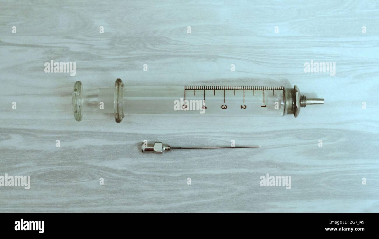 Glass syringe with a metal needle Stock Photo