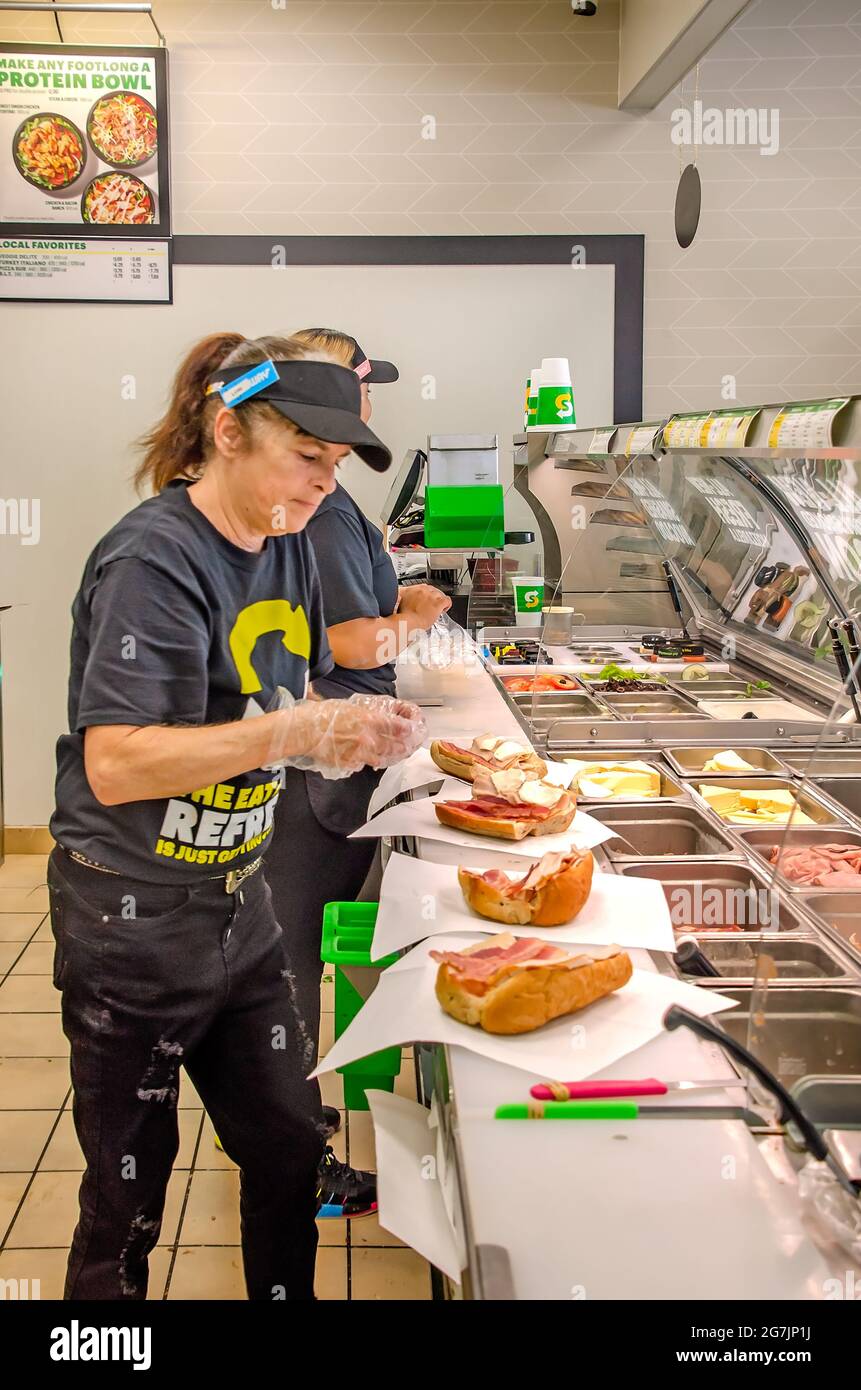 A Subway sandwich artist prepares sandwiches on the first day of the  “Eat Fresh Refresh” campaign, July 13, 2021, in Bayou La Batre, Alabama. Stock Photo
