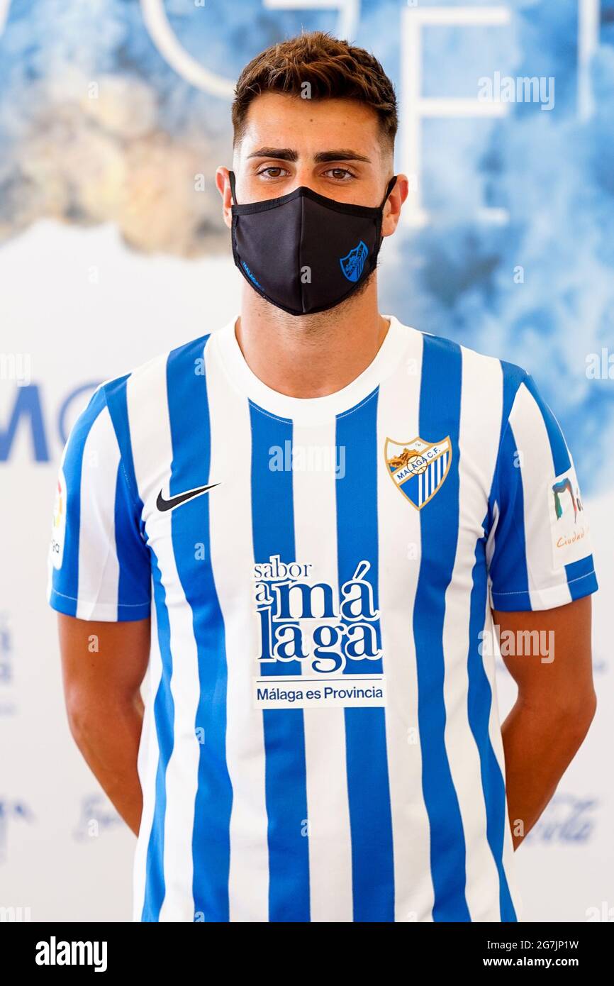 Malaga, Spain. 14th July, 2021. Football player Luis Muñoz wearing the  official Malaga CF uniform for the 2021/2022 season, poses for the media at  Baños del Carmen in Malaga. Credit: SOPA Images
