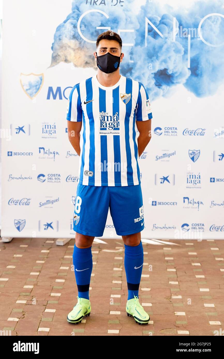 Malaga, Spain. 14th July, 2021. Football player Luis Muñoz wearing the  official Malaga CF uniform for the 2021/2022 season poses for the media at  Baños del Carmen in Malaga. Credit: SOPA Images
