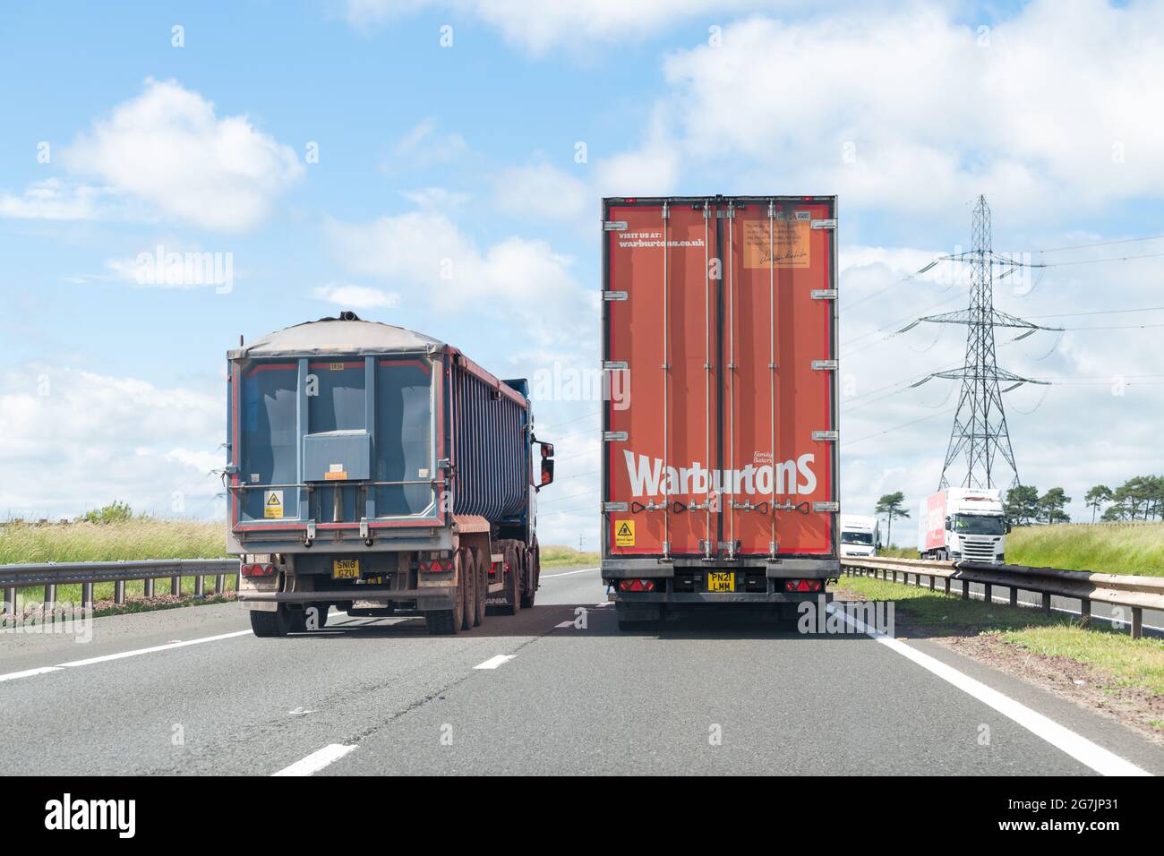 Lorry overtaking another lorry - UK Stock Photo