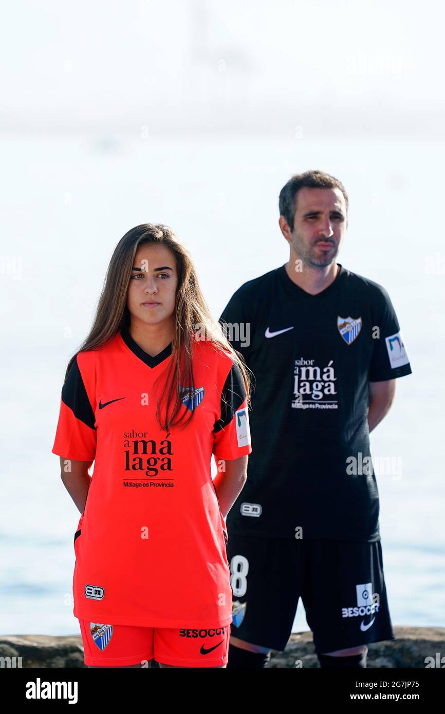 Malaga, Spain. 14th July, 2021. Marina Galvez (l) wearing second jersey of  Malaga CF and Pablo Sanchez (r) wearing third jersey of Malaga CF are seen  during the Presentation of the official