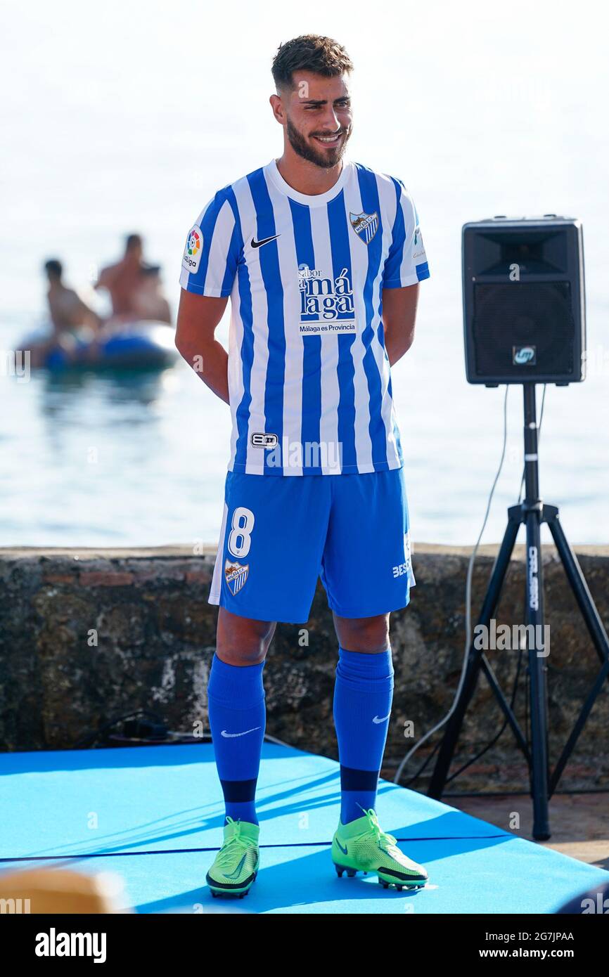 Malaga Spain. 14th July 2021. Football player Luis Munoz wearing the official Malaga CF uniform for the 2021 2022 season poses for the media at Banos del Carmen in Malaga. Photo by Francis