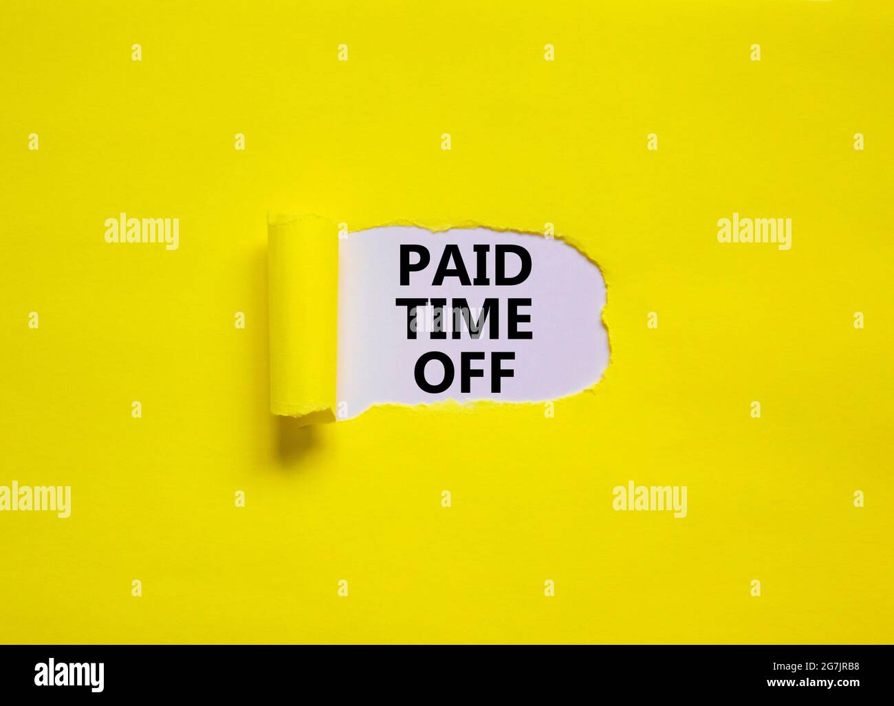 Paid time off symbol. Words 'Paid time off' appearing behind torn