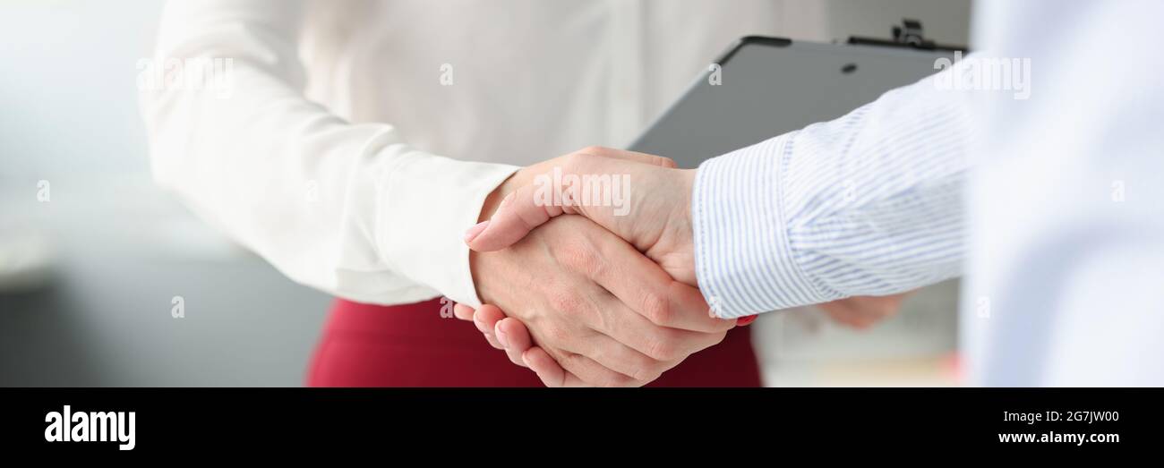 Business people shake hands in handshake closeup Stock Photo