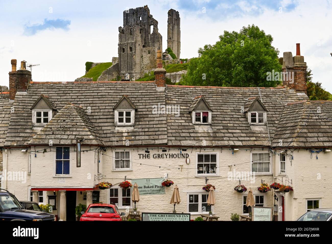 Corfe Castle, Dorset, England - June 2021: Exterior view of the Greyhound pub in the village. Stock Photo