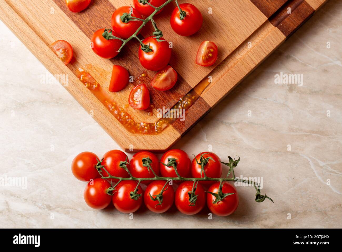 Top view of cherry tomatoes on a wooden board Stock Photo - Alamy