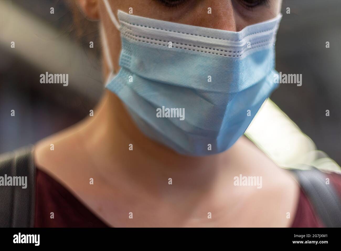 Photo of girl with anti covid mask. Symbol of everyday life. Stock Photo