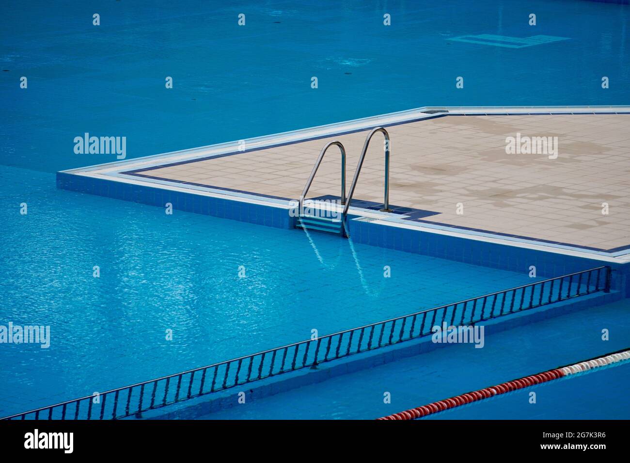Empty swimming pool with stairs Stock Photo - Alamy