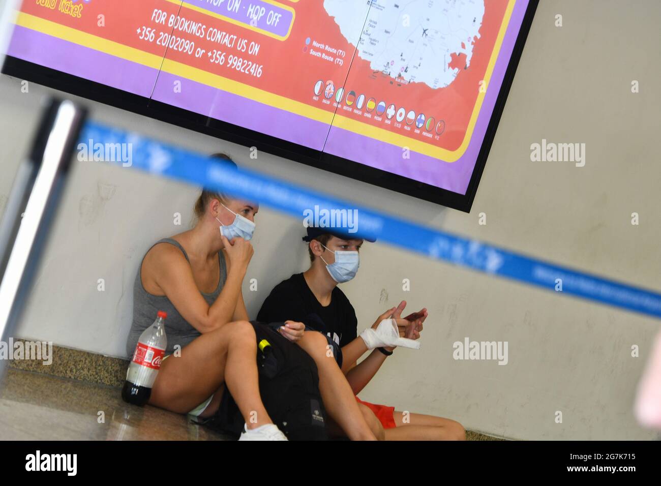 Luqa, Malta. 14th July, 2021. Students are seen at the Malta International Airport in Luqa, Malta, on July 14, 2021. Malta closed its English language teaching schools on Wednesday in an effort to counter a spike in new COVID-19 cases. Credit: Jonathan Borg/Xinhua/Alamy Live News Stock Photo