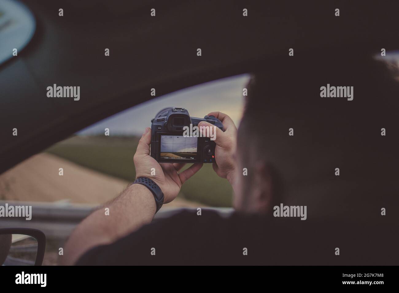 Pusle Using His Camera Male traveler capturing view hi-res stock photography and images - Alamy