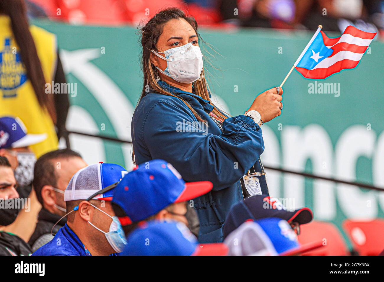 MAZATLAN, MEXICO - JANUARY 31: Puertorican Fans with masks due to Covid 19, during the game between Puerto Rico and Dominican Republic as part of Serie del Caribe 2021 at Teodoro Mariscal Stadium on January 31, 2021 in Mazatlan, Mexico. (Photo by Luis Gutierrez/Norte Photo/) Stock Photo