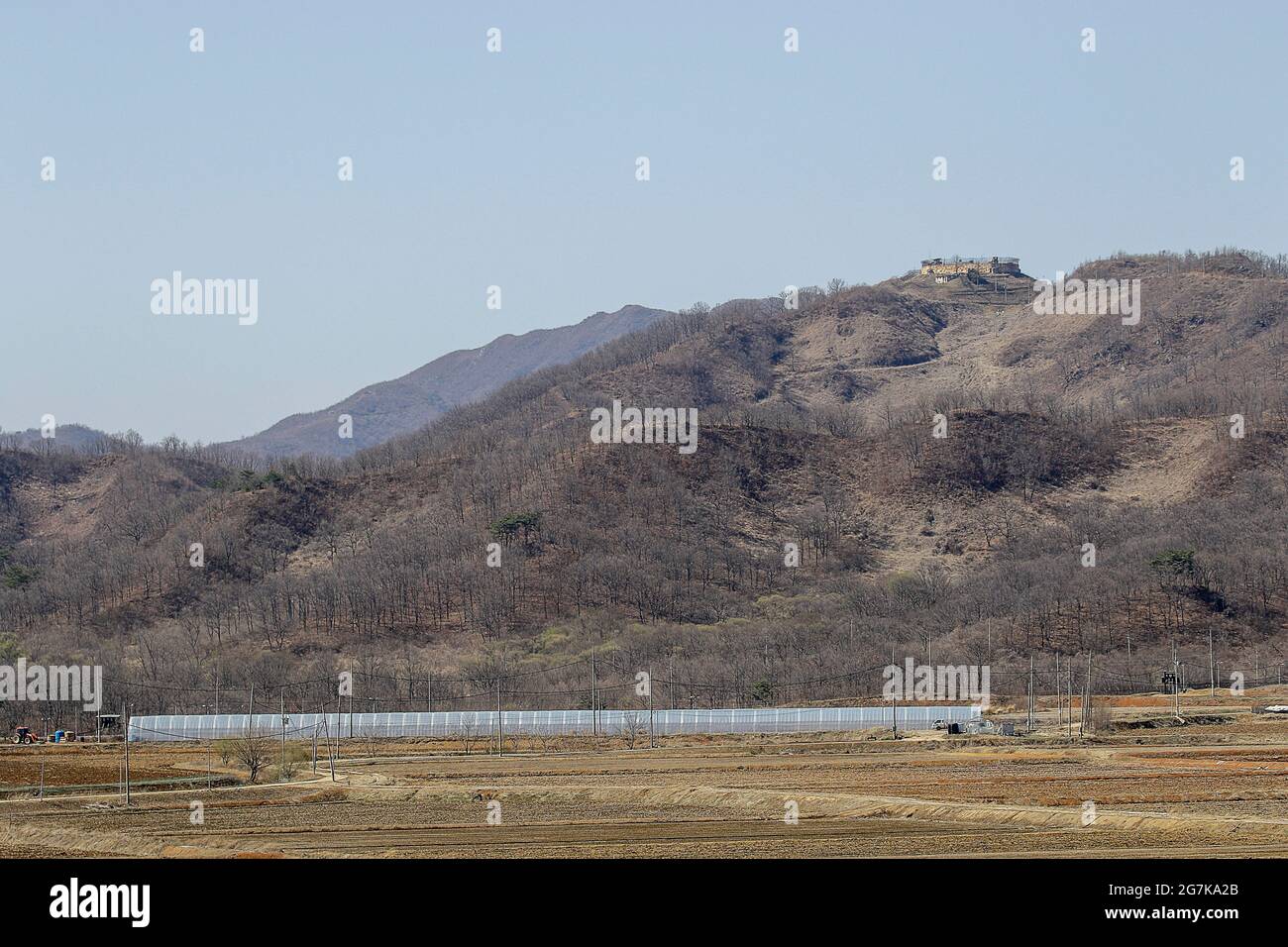 April 11, 2018-Goyang, South Korea-A View of Korean War battle of white horse and the Civilian Control Line in Cheorwon, South Korea. The Battle of White Horse was another in a series of bloody battles for dominant hilltop positions during the Korean War. Baengma-goji was a 395-metre (1,296 ft) hill in the Iron Triangle, formed by Pyonggang at its peak and Gimhwa-eup and Cheorwon at its base, was a strategic transportation route in the central region of the Korean peninsula. White Horse was the crest of a forested hill mass that extended in a northwest-to-southeast direction for about two mile Stock Photo