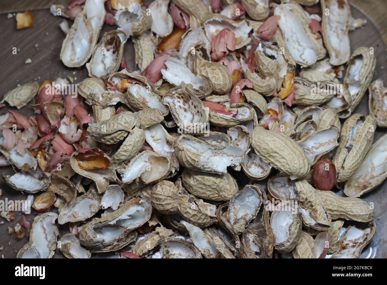 Heap of empty peanut shells spread over the floor Stock Photo Alamy