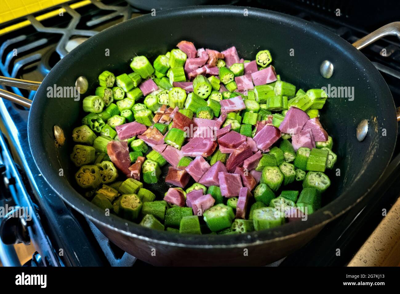 Preparing okra and tasso for gumbo, New Orleans, Louisiana, U.S.A Stock Photo