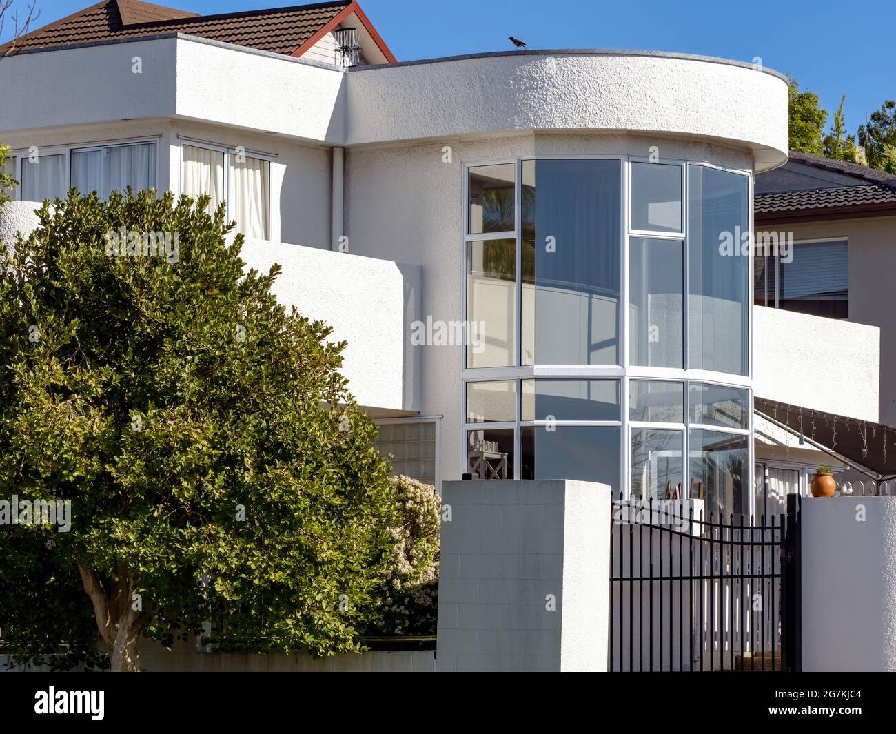 AUCKLAND, NEW ZEALAND - Jun 21, 2021: View of house with two story bay 