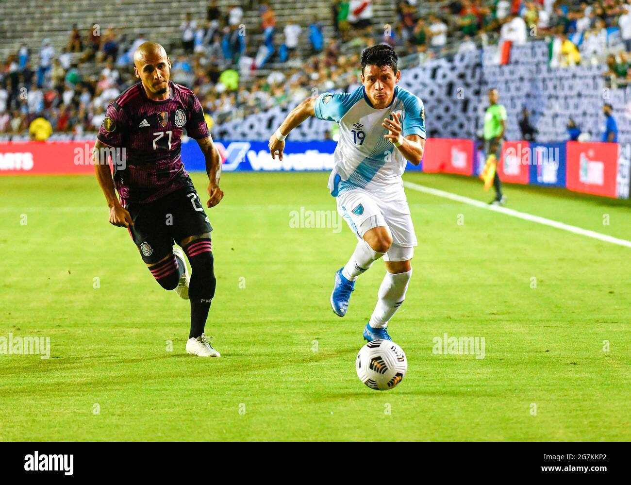 Jul 14, 2021: Guatamala forward Robin Betancourth (19) races to the ball against Mexico defender Luis Rodriguez (21) in the first half during a CONCACAF Gold Cup game between Mexico and Guatemala at the Cotton Bowl Stadium in Dallas, TX Mexico defeated Guatemala 3-0Albert Pena/CSM Stock Photo