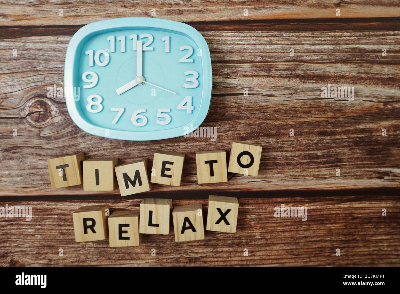 Time To Relax alphabet letter with alarm clock on wooden background ...