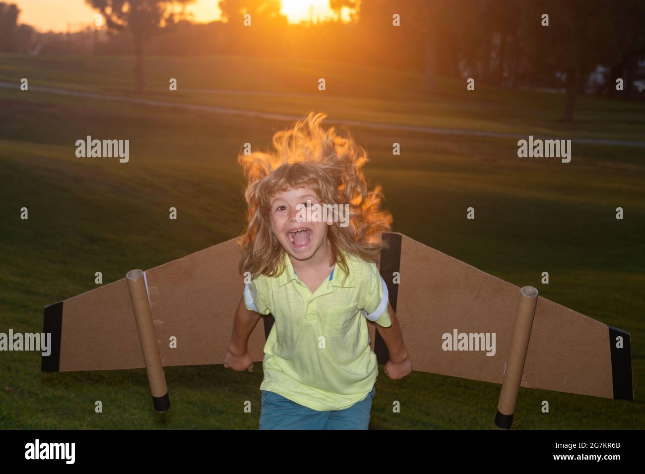 Excited child dreams of a rocket pilot. Imagination and