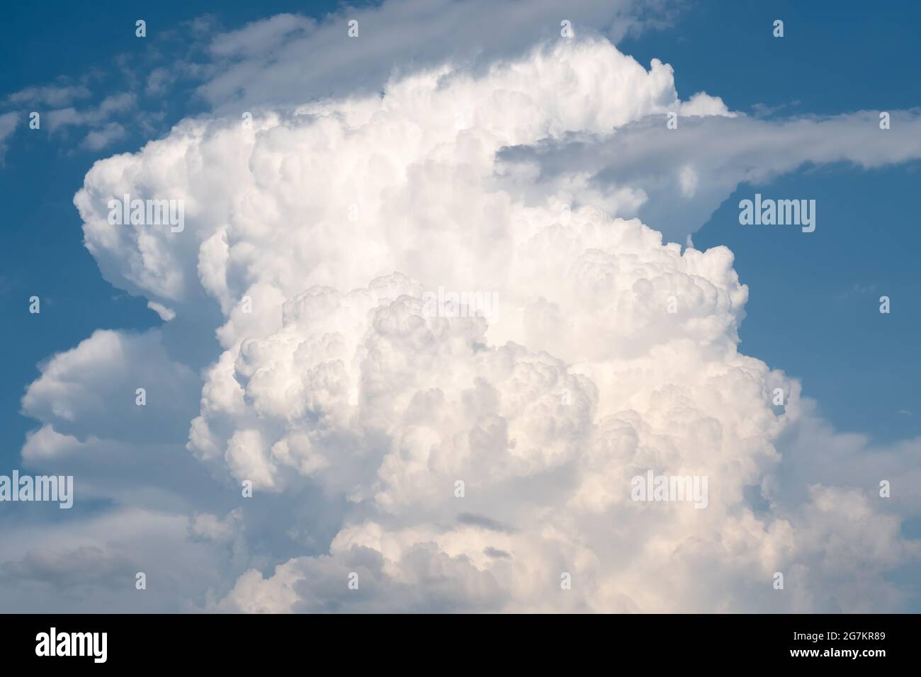 White fluffy clouds on blue hi-res stock photography and images - Alamy
