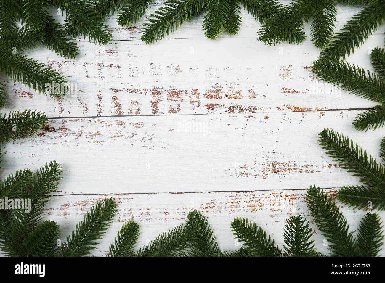 Christmas background with fir tree branches border frame on wooden ...