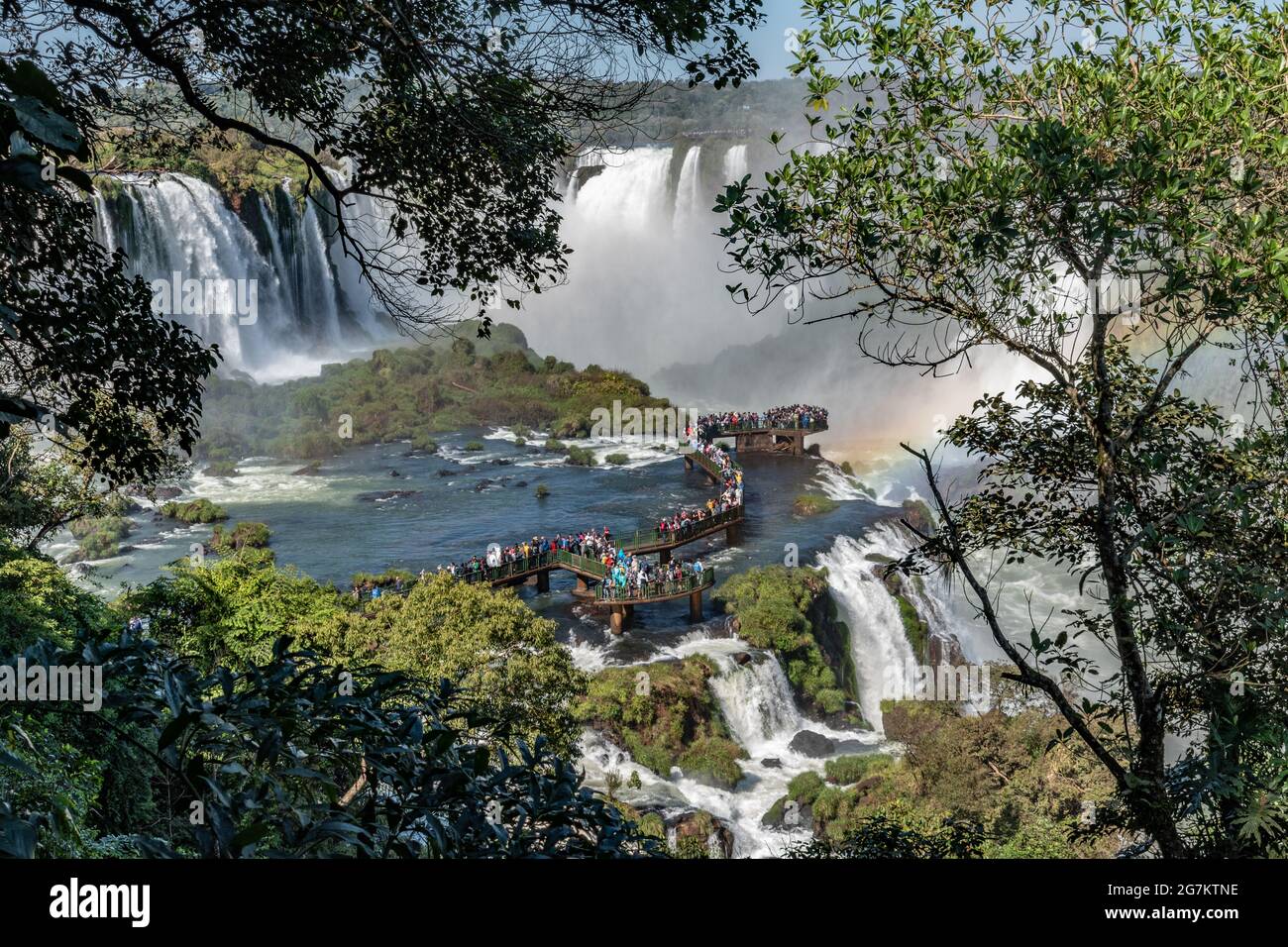 Tourists crowd on a boardwalk to get a close-up view of Iguazu Falls as seen from the Brazilian side Stock Photo